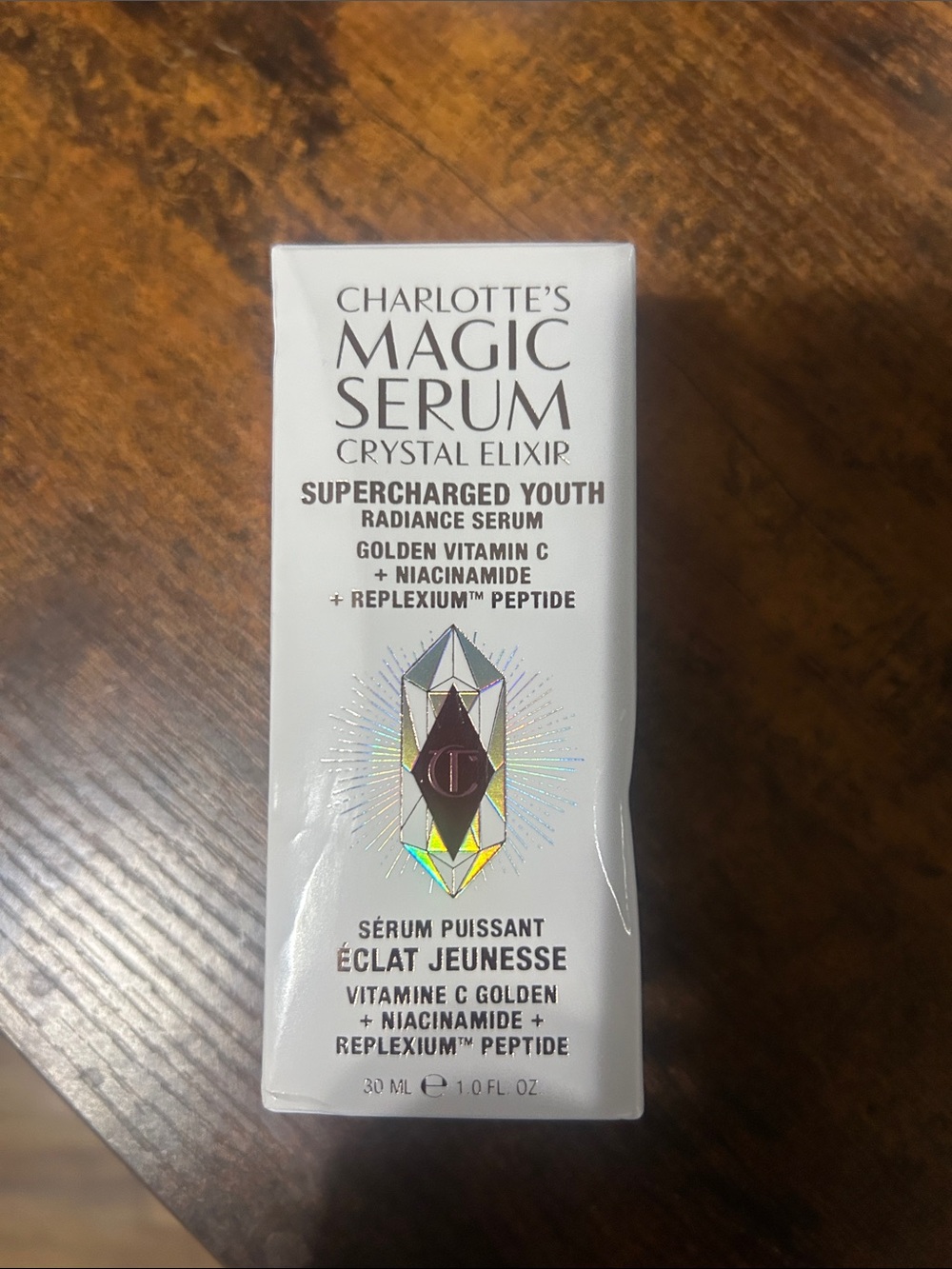 Charlotte Tilbury White Serum Bottle with Holographic Emblem